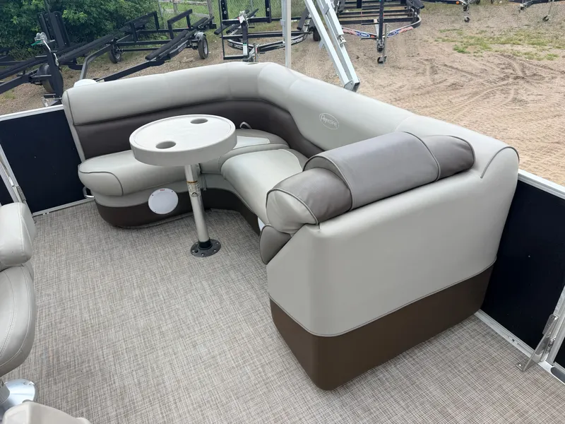 Slide: The Image of The image shows a cozy seating area on a boat with a small table in the center. - 28