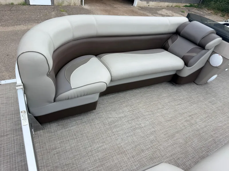 Slide: The Image of A sleek, upholstered seating sofa on a boat with beige carpet flooring. - 15