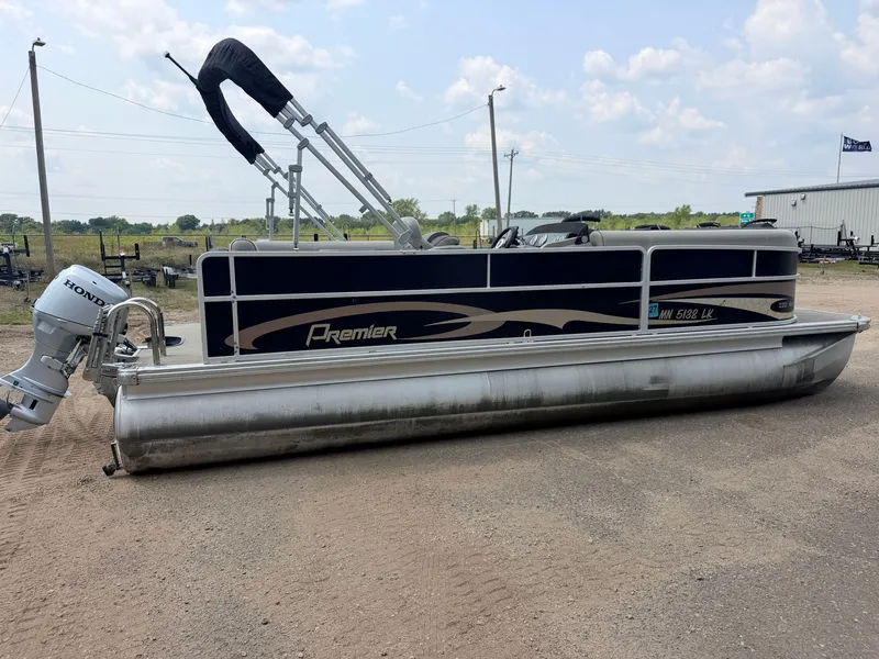 Slide: The Image of A 2016 Premier 220 SunSpree pontoon boat with a 50HP Honda 4-stroke engine, parked on a lot. - 49