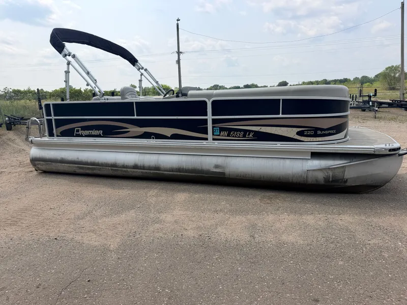 Slide: The Image of A 2016 Premier 220 SunSpree pontoon boat with a 50HP Honda 4-stroke engine, on a trailer. - 18