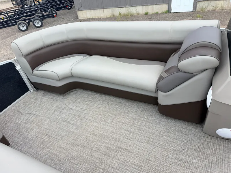 Slide: The Image of The image shows an elegant, upholstered seating area in a boat with a gray and brown design. - 16