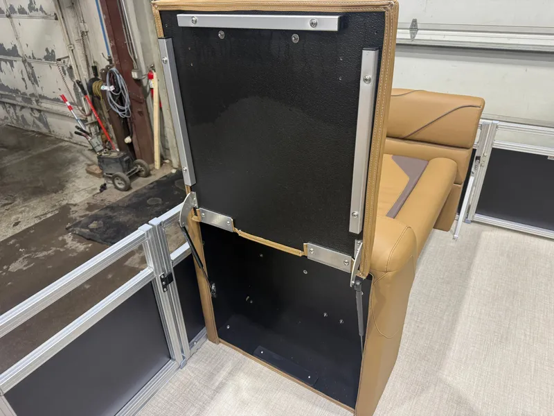 Slide: The Image of The rear bench of a boat with the backrest lifted, revealing storage underneath. - 22