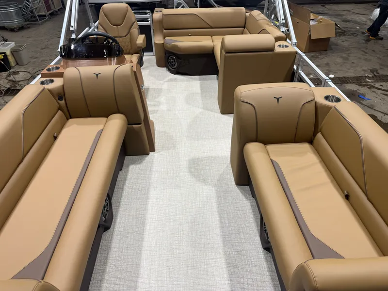 Slide: The Image of The image shows the interior of a 2027 Tahoe Sport 1980 Cruise Rear Bench (CRB) with Honda 4-Stroke EFI. It features beige upholstered seating and a central helm. - 6