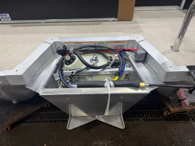 Slide: The Image of An open compartment on a boat reveals cables and a motor. - 37