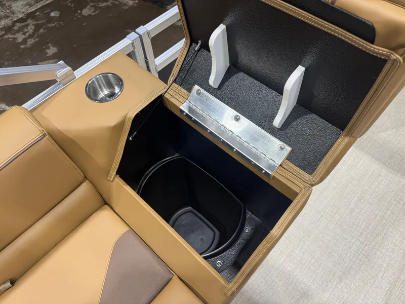 Slide: The Image of A brown seat with built-in storage and a cup holder on a boat. - 20