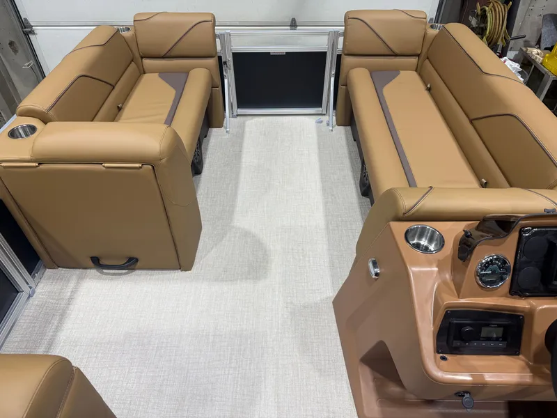 Slide: The Image of Interior view of a modern boat with beige leather seating and a helm station. - 25