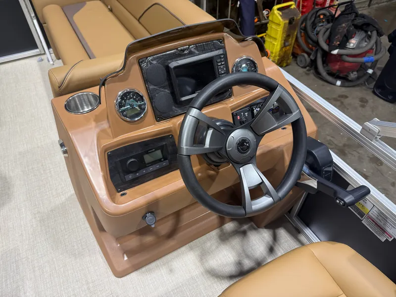 Slide: The Image of The image shows the cockpit of a 2027 Tahoe Sport 1980 Cruise Rear Bench (CRB) with Honda 4-Stroke EFI. It features a modern steering wheel, gauges, and controls on a brown dashboard. - 11