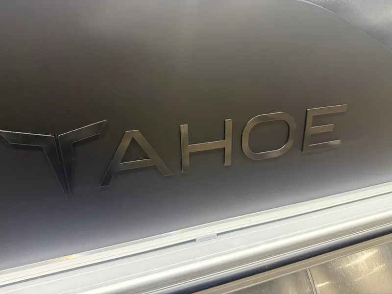 Slide: The Image of Close-up of the Tahoe logo on a boat. - 34