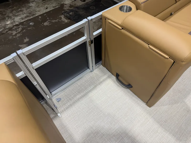 Slide: The Image of The image shows a beige bench seat with a cup holder and handle on a boat. - 21
