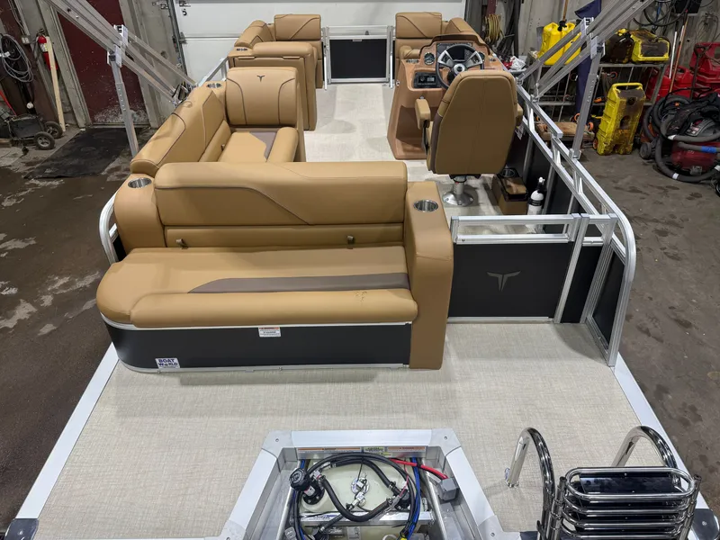 Slide: The Image of Interior view of a modern pontoon boat with beige seating and a helm station. - 5