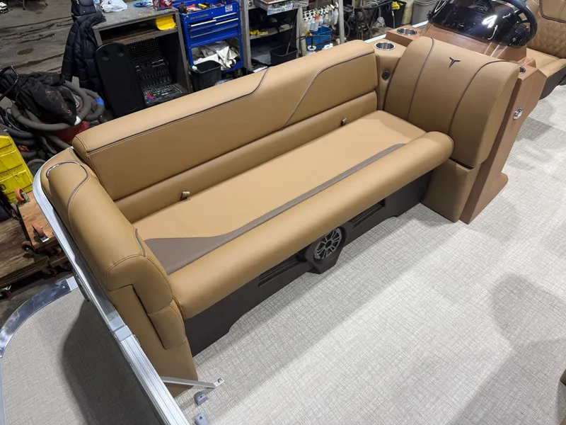 Slide: The Image of The image shows a beige bench seat on a boat with a modern dashboard. - 7
