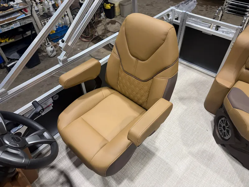 Slide: The Image of Comfortable, padded captain's chair in a modern boat with steering wheel and armrests. - 10