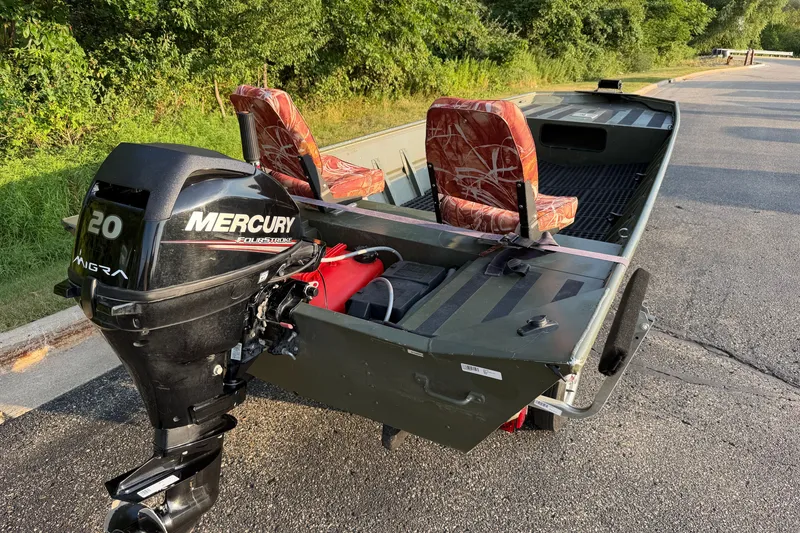 Slide: The Image of 2017 Alumacraft MV 1648 Jon boat with Mercury 20 HP outboard motor on a trailer. - 5