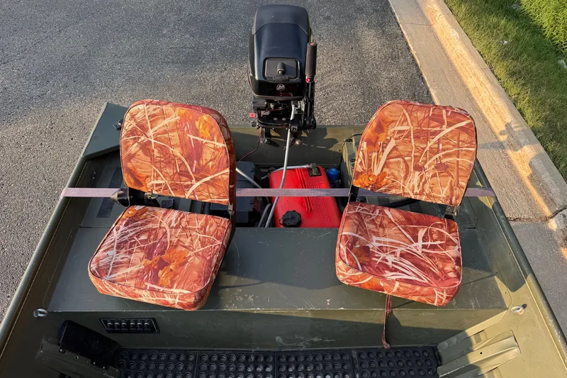 Slide: The Image of 2017 Alumacraft MV 1648 Jon boat with camo seats and outboard motor. - 9