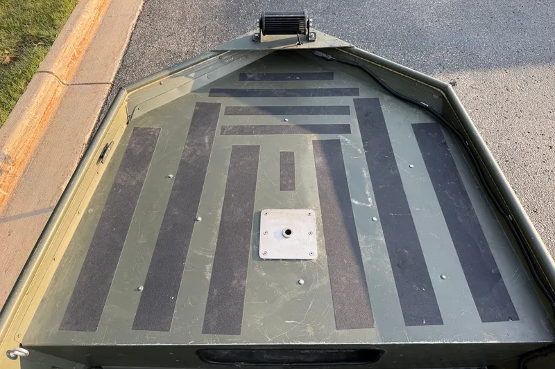 Slide: The Image of 2017 Alumacraft MV 1648 Jon boat deck with non-slip surface and mounting plate. - 13