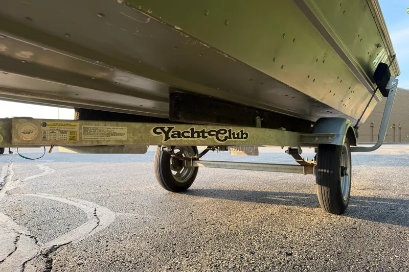 Slide: The Image of 2017 Alumacraft MV 1648 Jon boat on Yacht Club trailer, parked on asphalt. - 19
