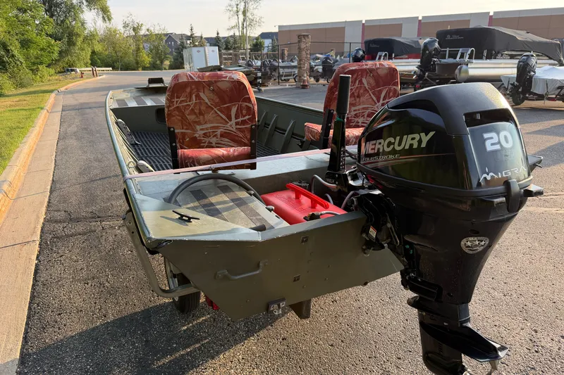 Slide: The Image of 2017 Alumacraft MV 1648 Jon boat with Mercury 20HP engine, parked on a sunny day. - 8