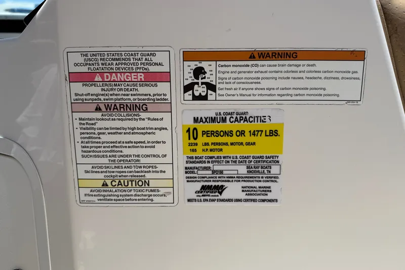 Slide: The Image of Safety and capacity labels on a 2019 Sea Ray SPX 190 Outboard boat. - 45