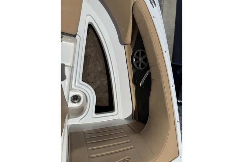 Slide: The Image of 2019 Sea Ray SPX 190 Outboard boat interior with tan seating and speaker detail. - 11