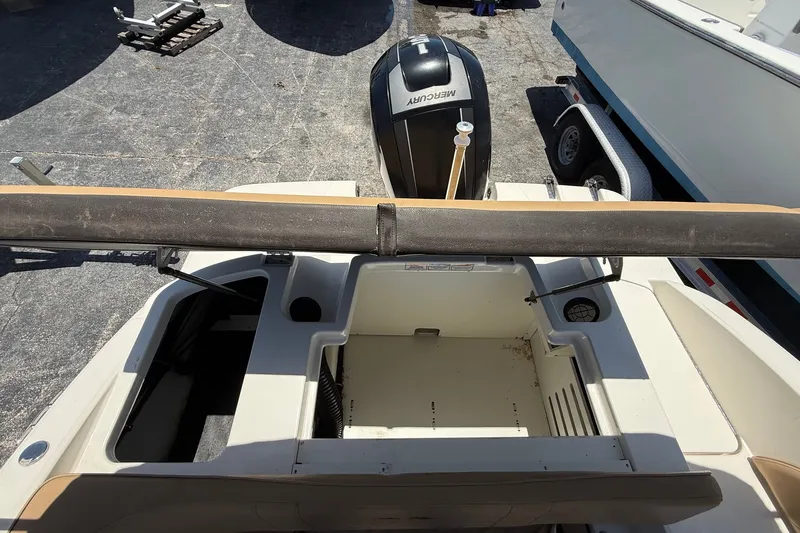 Slide: The Image of 2019 Sea Ray SPX 190 Outboard boat interior with Mercury engine, docked on trailer. - 43