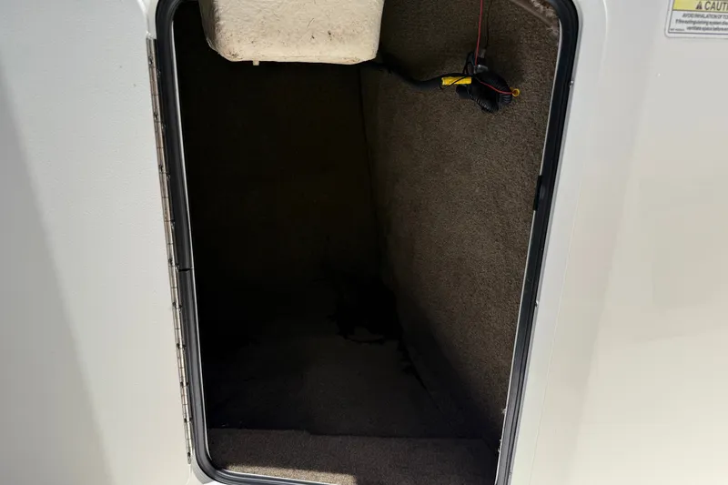 Slide: The Image of Storage compartment inside a 2019 Sea Ray SPX 190 Outboard boat. - 21