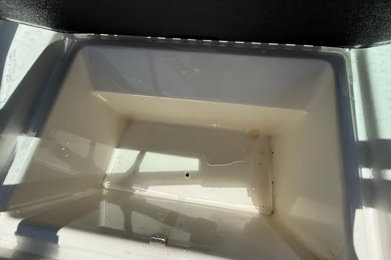 Slide: The Image of Empty storage compartment in a 2019 Sea Ray SPX 190 Outboard boat. - 24