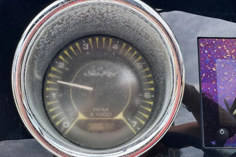 Slide: The Image of Close-up of a 2019 Sea Ray SPX 190 Outboard tachometer displaying RPM. - 8