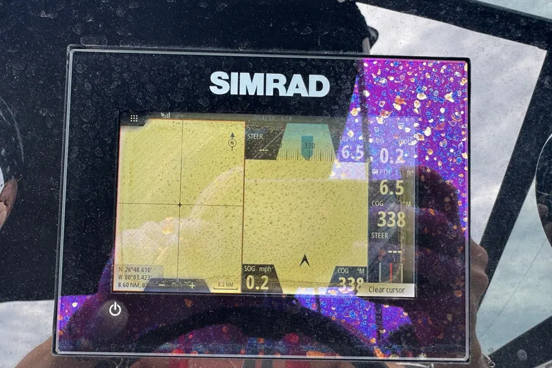 Slide: The Image of Simrad navigation display on 2019 Sea Ray SPX 190 Outboard boat. - 9