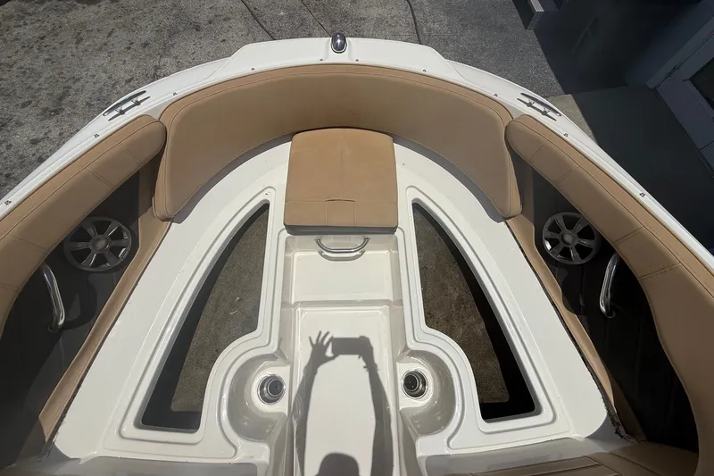 Slide: The Image of 2019 Sea Ray SPX 190 Outboard boat interior with tan seating and speaker system. - 13