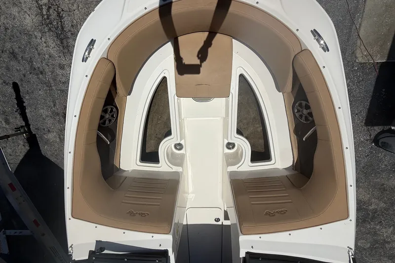 Slide: The Image of 2019 Sea Ray SPX 190 Outboard boat interior with tan seating and cup holders. - 14