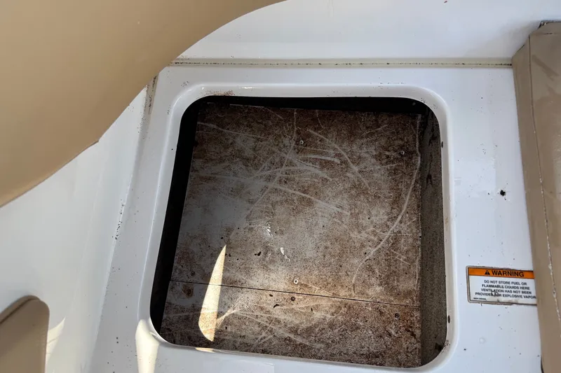 Slide: The Image of Storage compartment of a 2019 Sea Ray SPX 190 Outboard boat, showing interior details. - 32