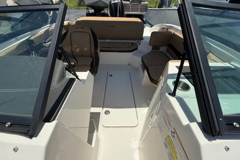 Slide: The Image of 2019 Sea Ray SPX 190 Outboard boat interior with seating and windshield. - 16
