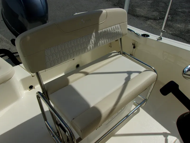Slide: The Image of Beige cushioned bench with stainless steel frame on a boat, surrounded by white deck. - 10