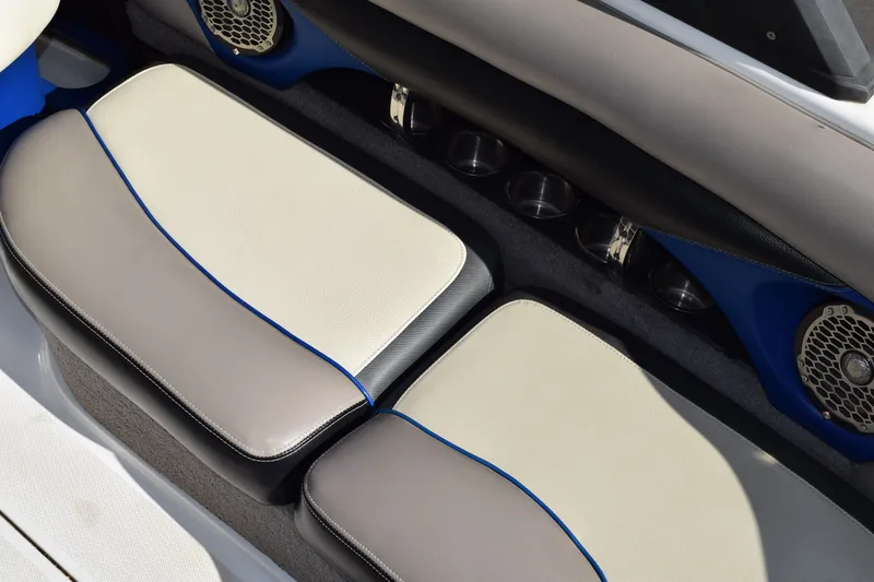 Slide: The Image of 2013 Malibu Wakesetter 23 LSV interior seating with cup holders and speakers. - 8