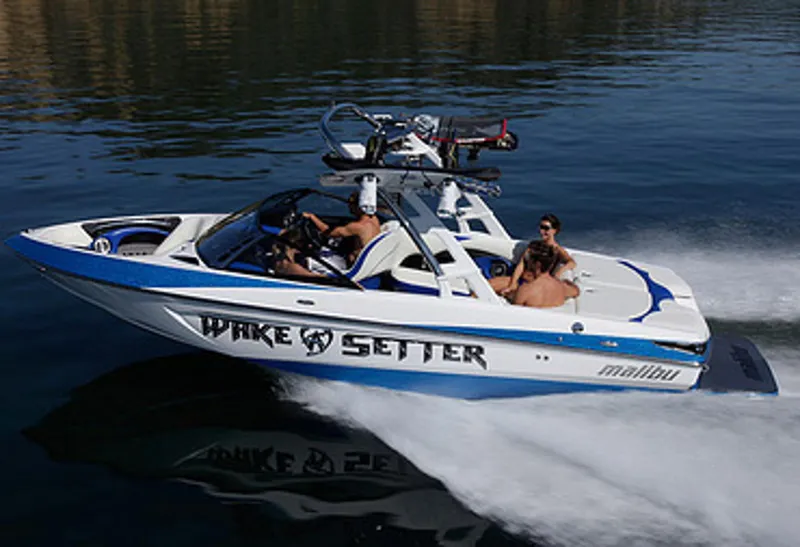 Slide: The Image of Manufacturer Provided Image: 2013 Malibu Wakesetter 23 LSV speedboat on water with passengers. - 19