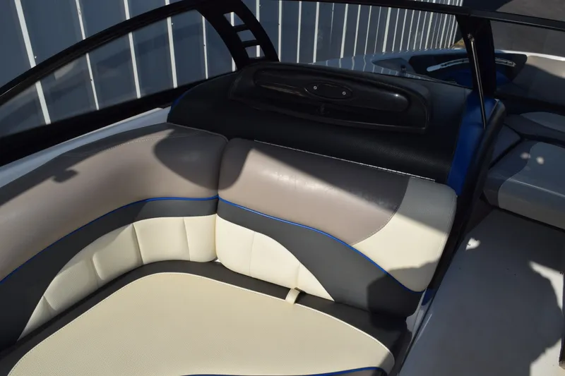Slide: The Image of 2013 Malibu Wakesetter 23 LSV interior with beige and gray seating. - 12
