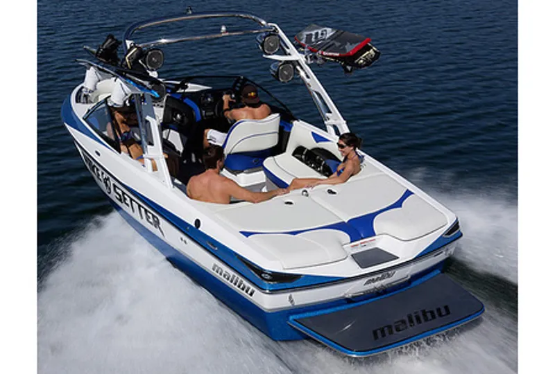 Slide: The Image of Manufacturer Provided Image: 2013 Malibu Wakesetter 23 LSV boat cruising on water with passengers. - 20