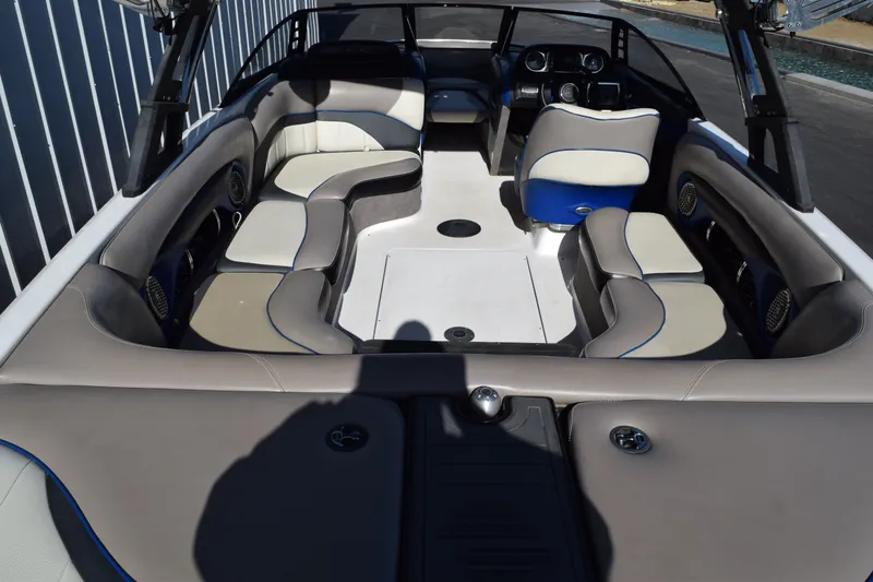 Slide: The Image of 2013 Malibu Wakesetter 23 LSV interior with spacious seating and modern dashboard. - 5