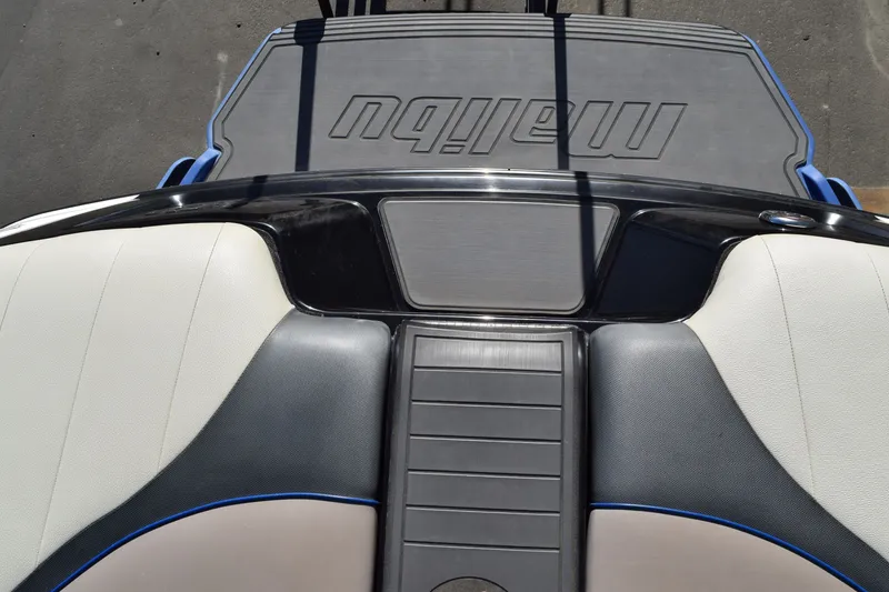 Slide: The Image of 2013 Malibu Wakesetter 23 LSV boat interior with sleek seating and deck design. - 18