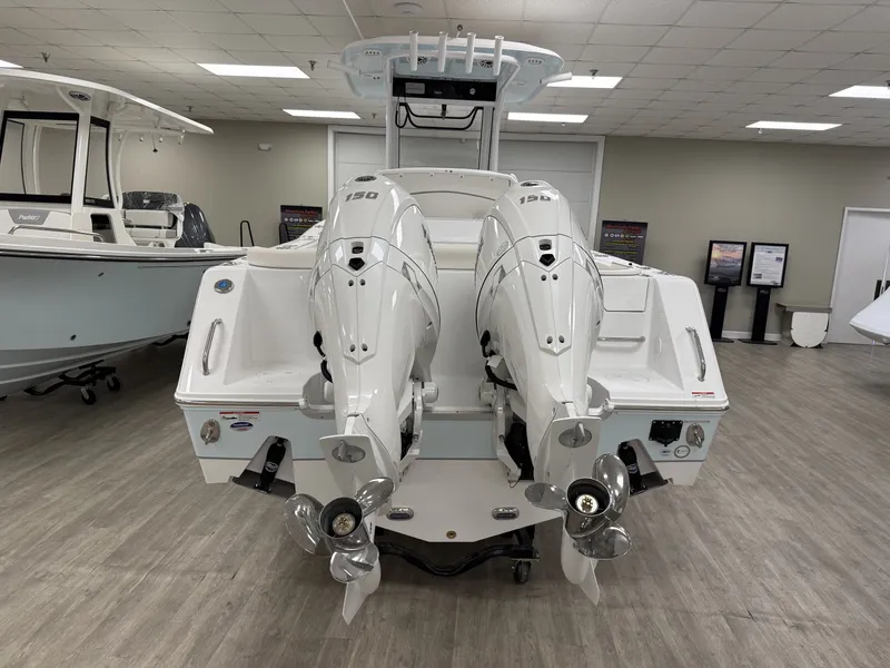 Slide: The Image of Two powerful outboard engines are mounted on the stern of a Sea Hunt Ultra 265 SE boat. - 2