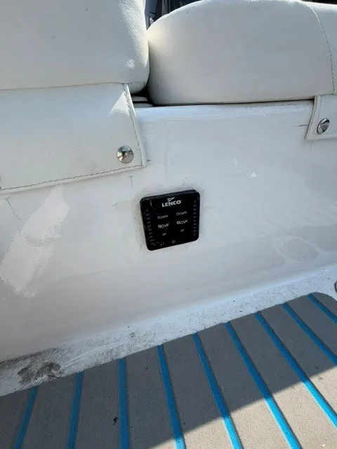 Slide: The Image of Close-up of a white boat seat with a Lenco control panel beneath it. - 5