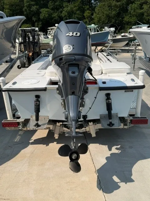 Slide: The Image of Rear view of a 2024 Salt Boatworks Flats River Skiff 15 with a 40 HP outboard motor. - 7