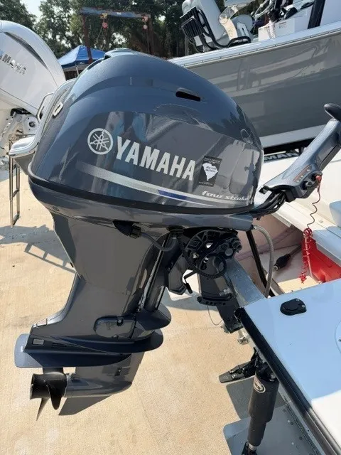 Slide: The Image of A Yamaha outboard motor is attached to a boat on a trailer. - 6