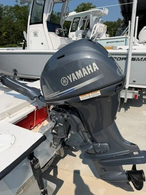 Slide: The Image of A Yamaha outboard motor is attached to a boat on a trailer. - 8
