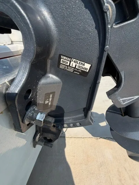 Slide: The Image of Close-up of a Yamaha outboard motor on a boat, showing technical details. - 4