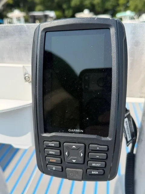 Slide: The Image of A Garmin navigation device is mounted on a boat. - 9
