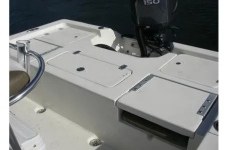 Slide: The Image of The image shows the stern of a 2021 Key West 210 Bay Reef boat with an outboard motor. - 16