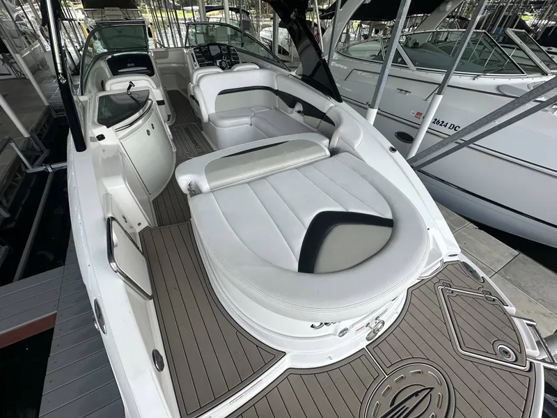 Slide: The Image of The image shows a 2011 Chaparral 287 SSX boat with sleek white seating and a modern cockpit. - 38