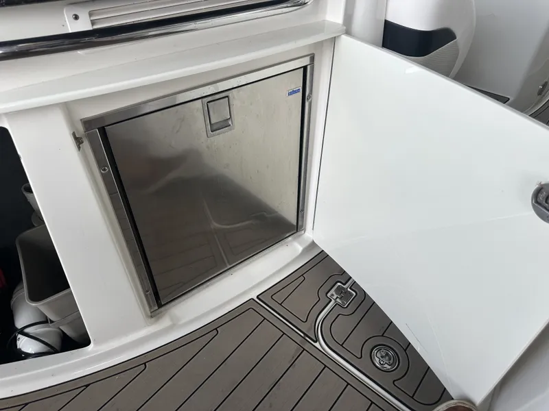 Slide: The Image of A stainless steel refrigerator is built into the deck of a 2011 Chaparral 287 SSX. - 15