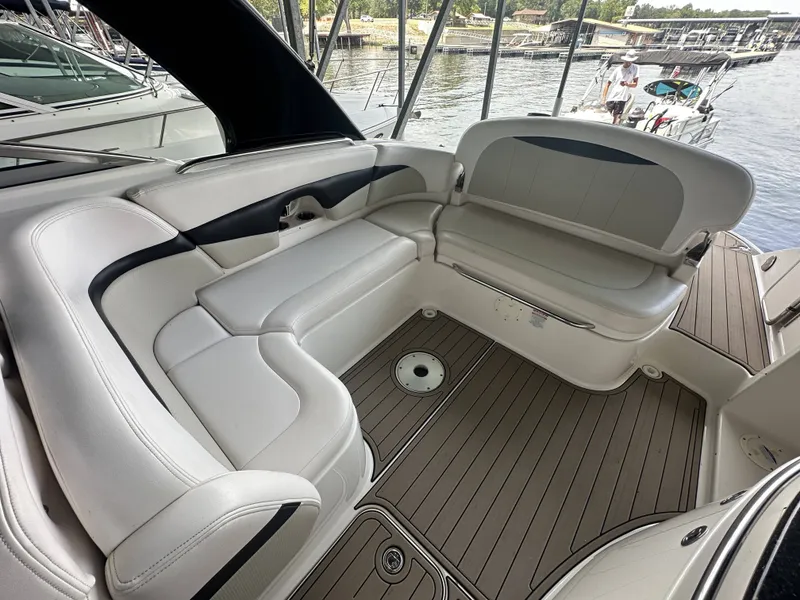Slide: The Image of The image shows the interior of a 2011 Chaparral 287 SSX with white leather seating. - 7